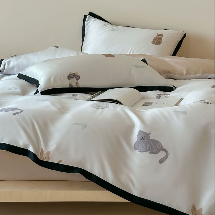Silk-gloss satin bedding set with minimalist cat illustrations and fine piping