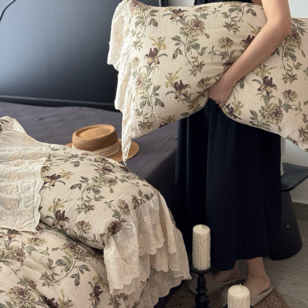 Floral quilted comfort bedspread with lace trim and decorative ruffle
