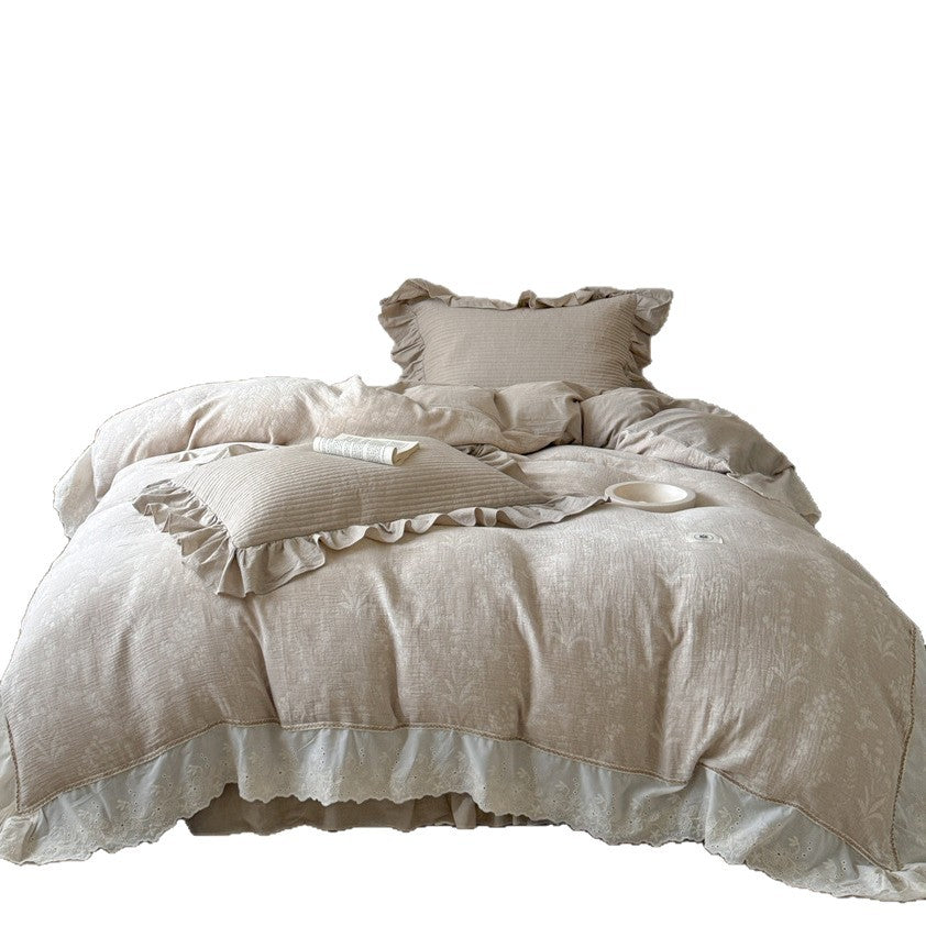Luxurious quilted cotton bedding set with ruffles and embroidered details