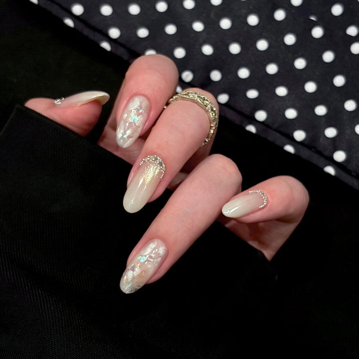 Artificial nails with shimmering accents and elegant applications Stornfield