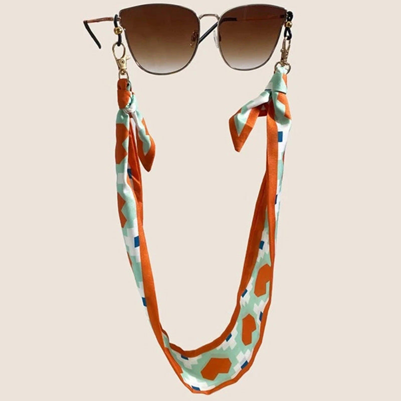 Fashionable fabric mask holder with floral motifs Stornfield