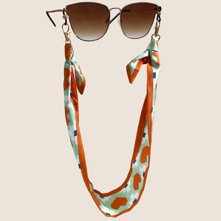 Fashionable fabric mask holder with floral motifs Stornfield