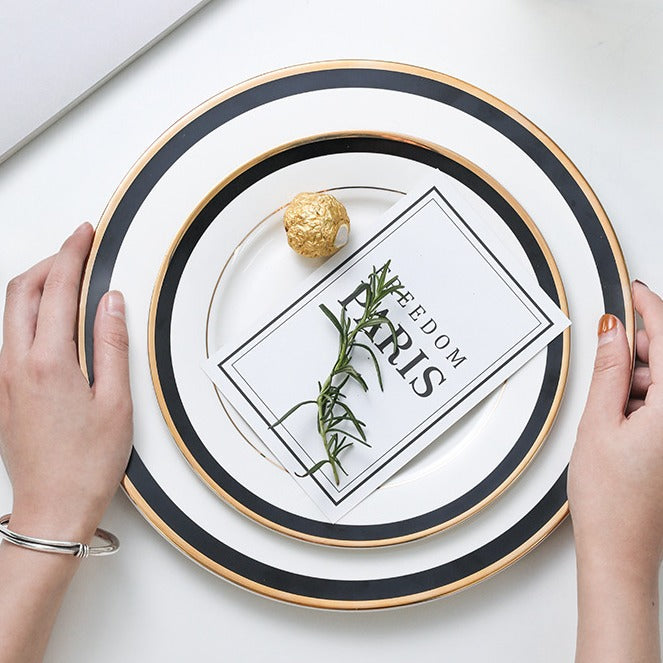 Porcelain plate with fine metal rim decoration and contrasting decorative ribbon