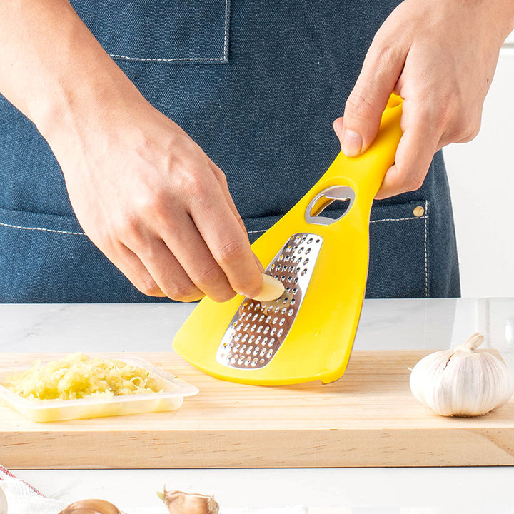 Multifunctional kitchen grater with integrated bottle opener function Stornfield