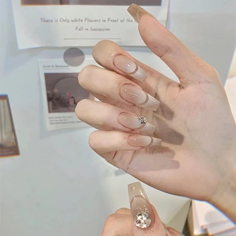 Glamorous artificial nails with elegant rhinestone decorations Stornfield
