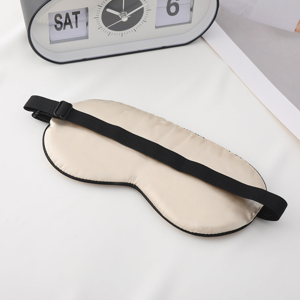 Unisex embroidered contoured sleep mask with decorative text embroidery and adjustable elastic band Stornfield