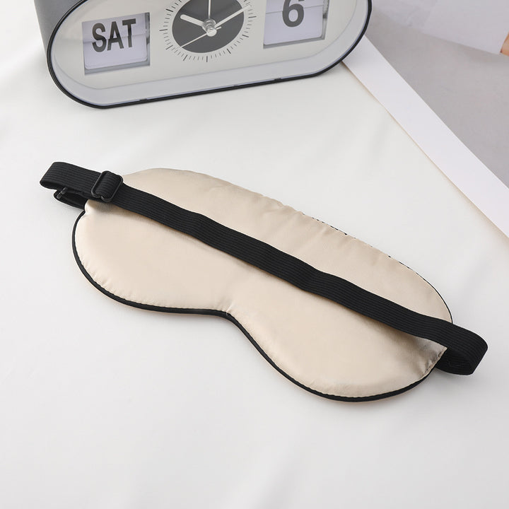 Unisex embroidered contoured sleep mask with decorative text embroidery and adjustable elastic band Stornfield