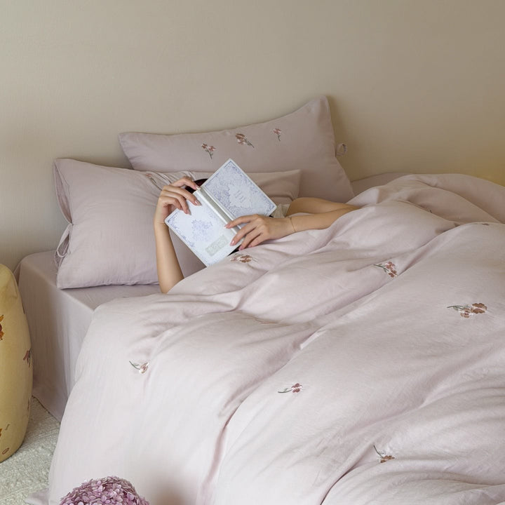 Embroidered cotton bedding set with delicate floral embroidery and tie bands