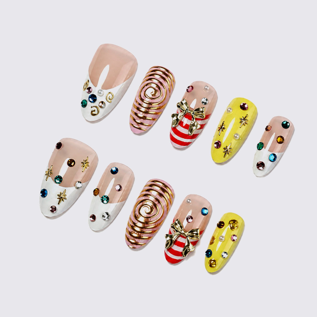 Glamorous artificial nail set with playful designs and sparkling accents Stornfield