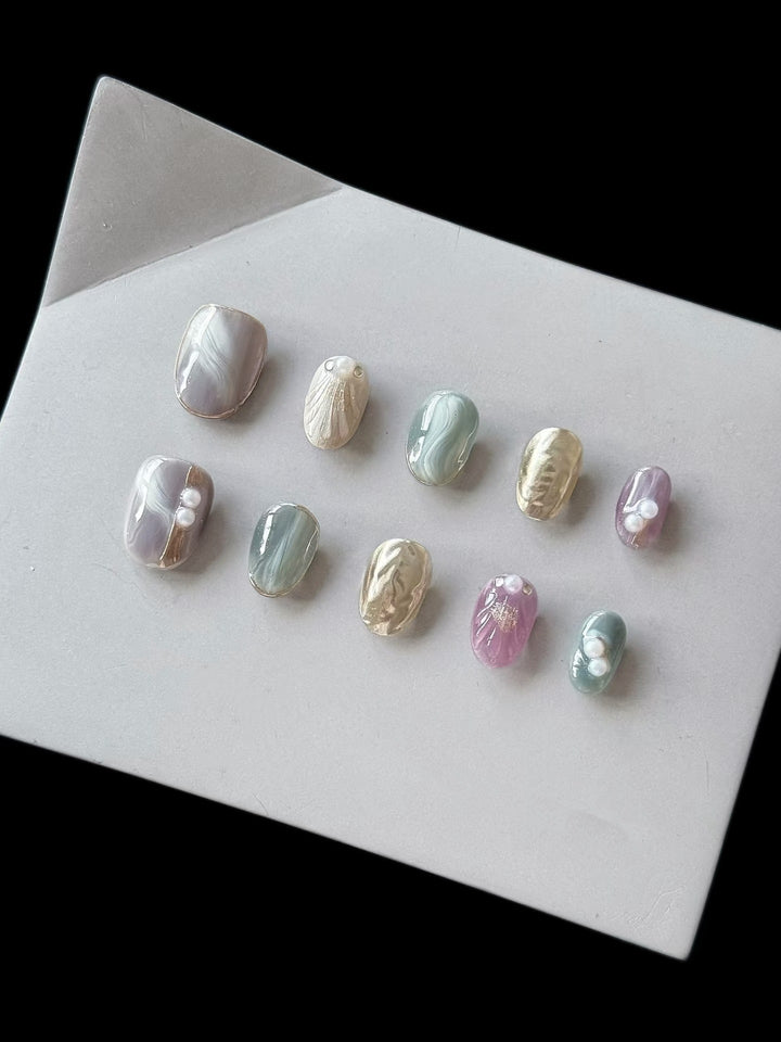 Artistic Press-On Nail Set with Natural Marble Designs