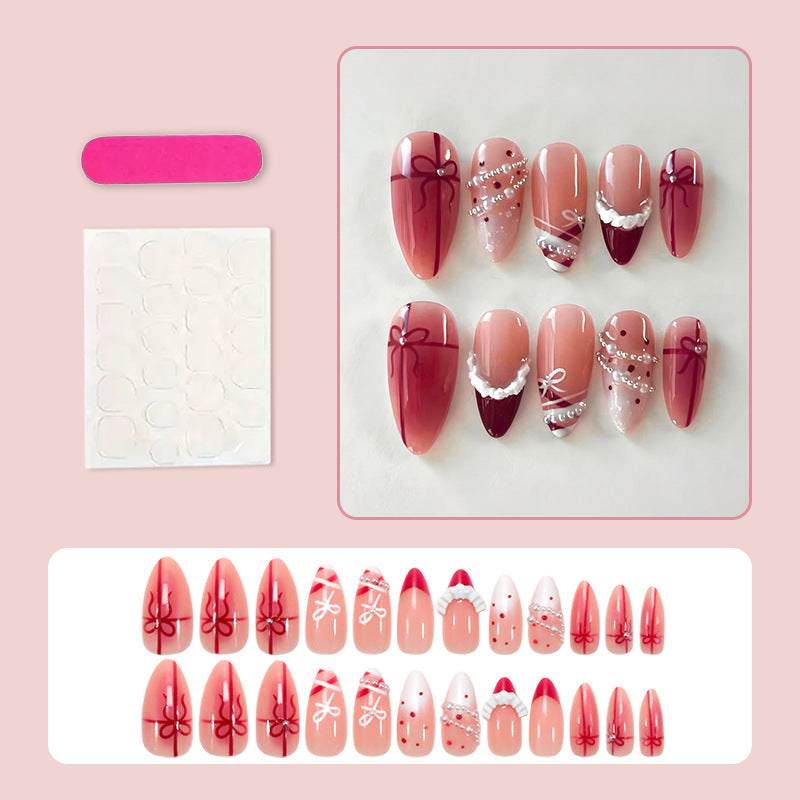 Nail set with glamorous bows and elegant pearl embellishments Stornfield