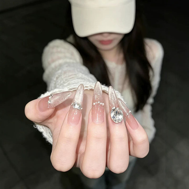 Artistic Stiletto Nail Enhancements with Gemstone Accents