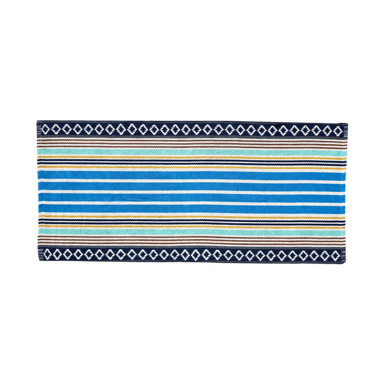 woven living room runner with fringes and geometric weave pattern