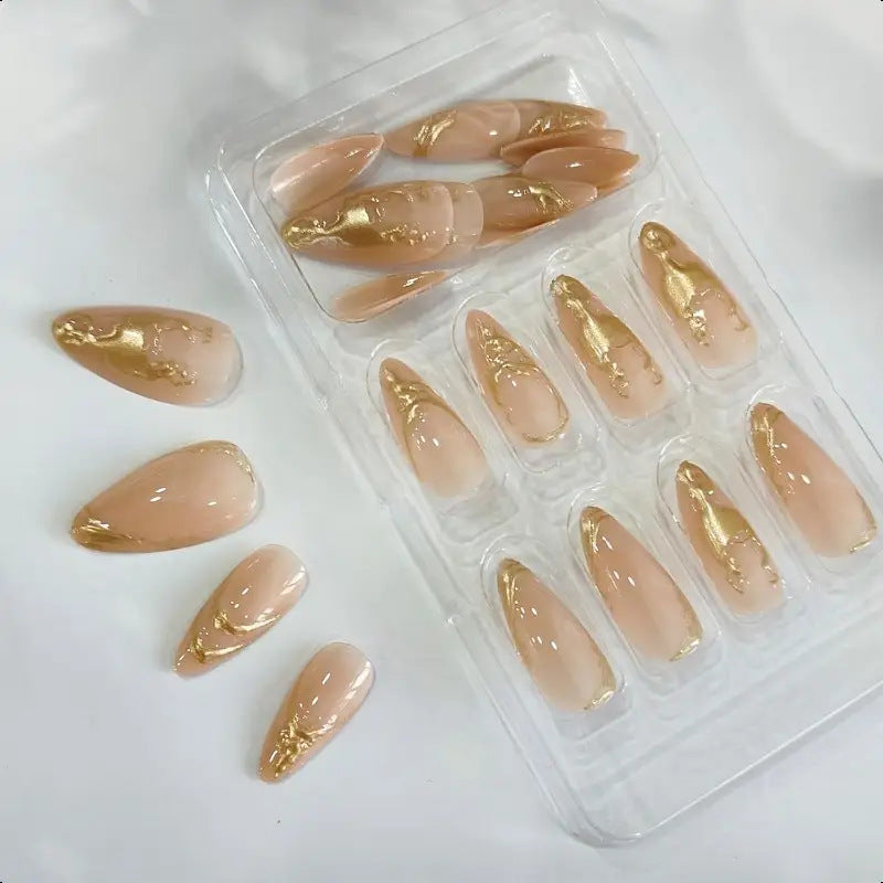 Elegant Stiletto Nail Enhancements with Gold Accent Details Stornfield