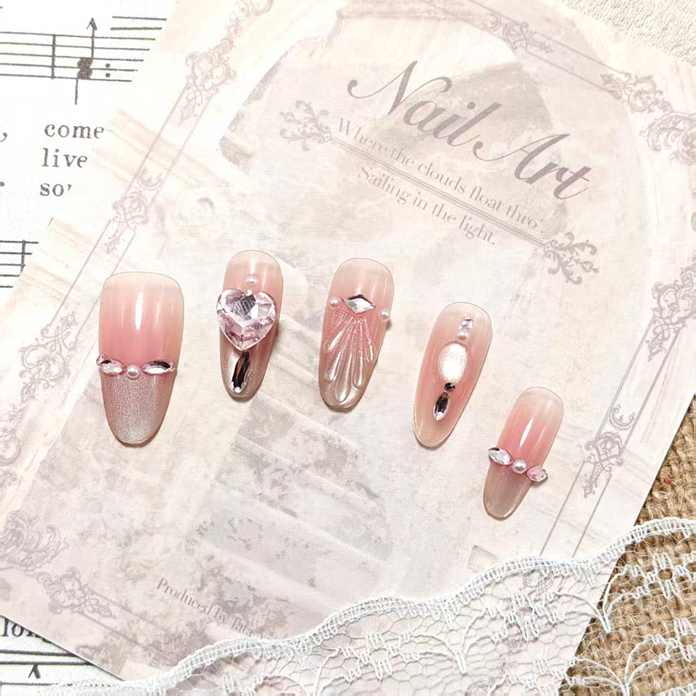 Artificial nails with sparkling heart and rhinestone accents Stornfield