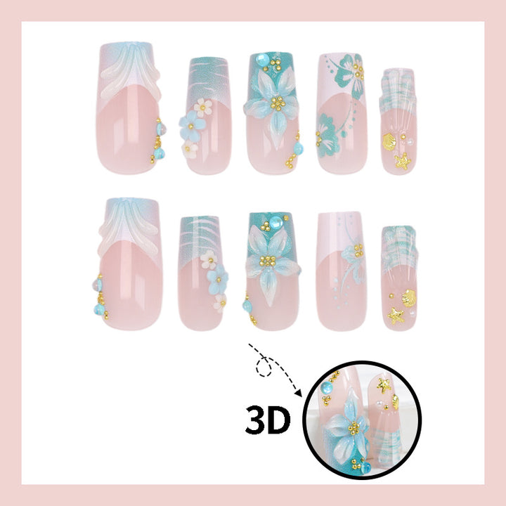 Acrylic nail set with elegant floral decorations and glitter accents Stornfield
