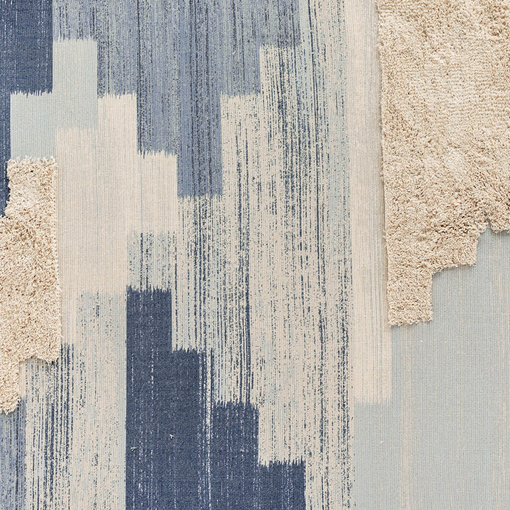 Modern woven living room rug with abstract structure and tufted high-pile accents Stornfield