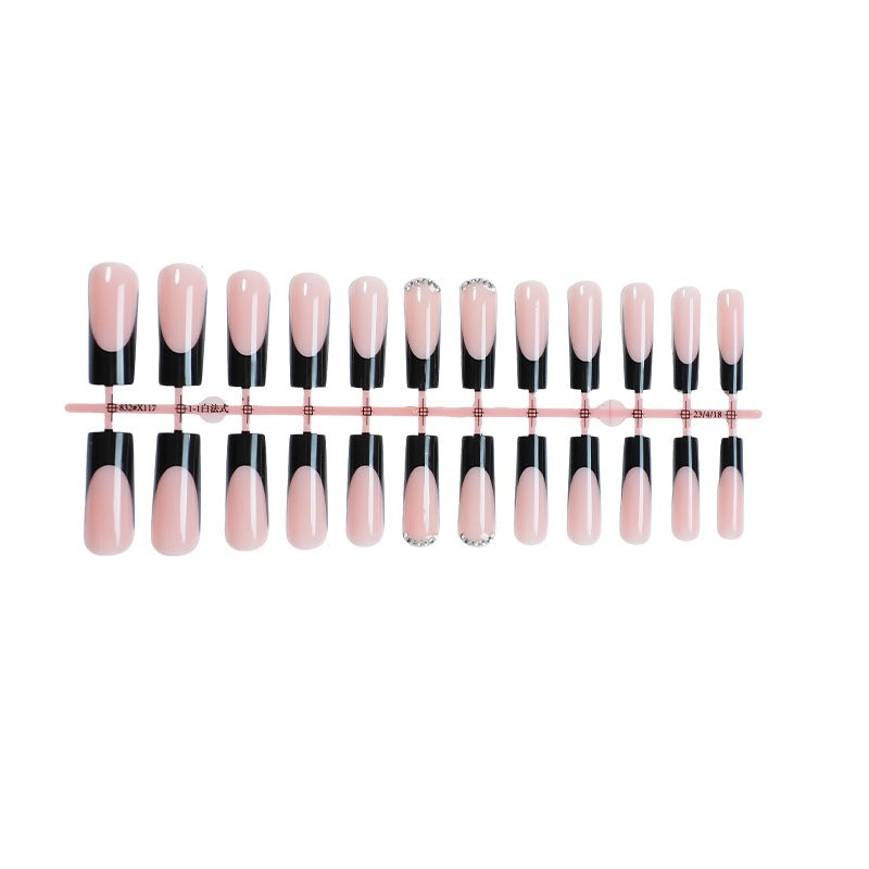 Nail set with elegant black and white colors and glitter accents Stornfield
