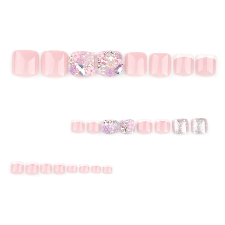 Artistic toenail art with floral accents and glitter Stornfield