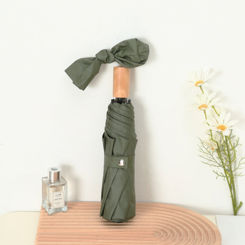 Ladies compact folding umbrella with elegant design and ergonomic wooden handle Stornfield