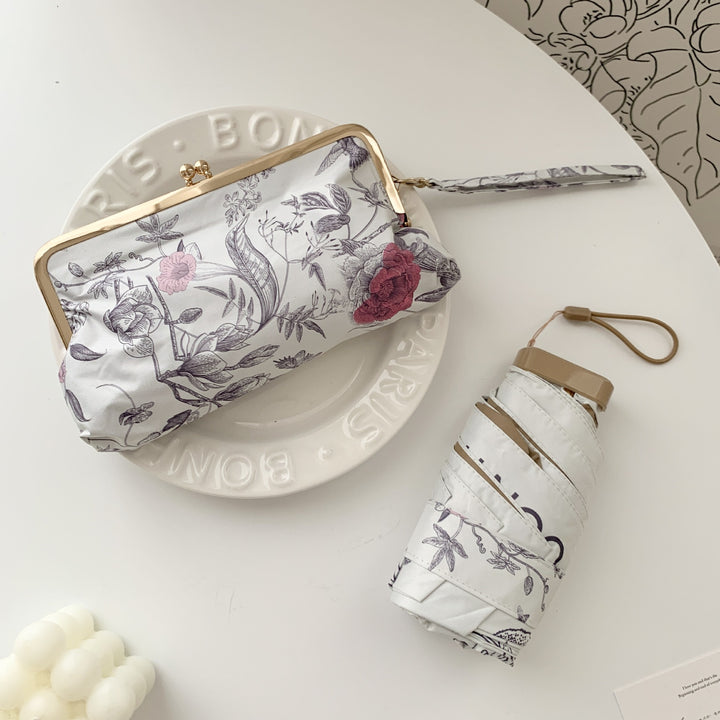 Ladies elegant folding umbrella with floral design and practical case Stornfield