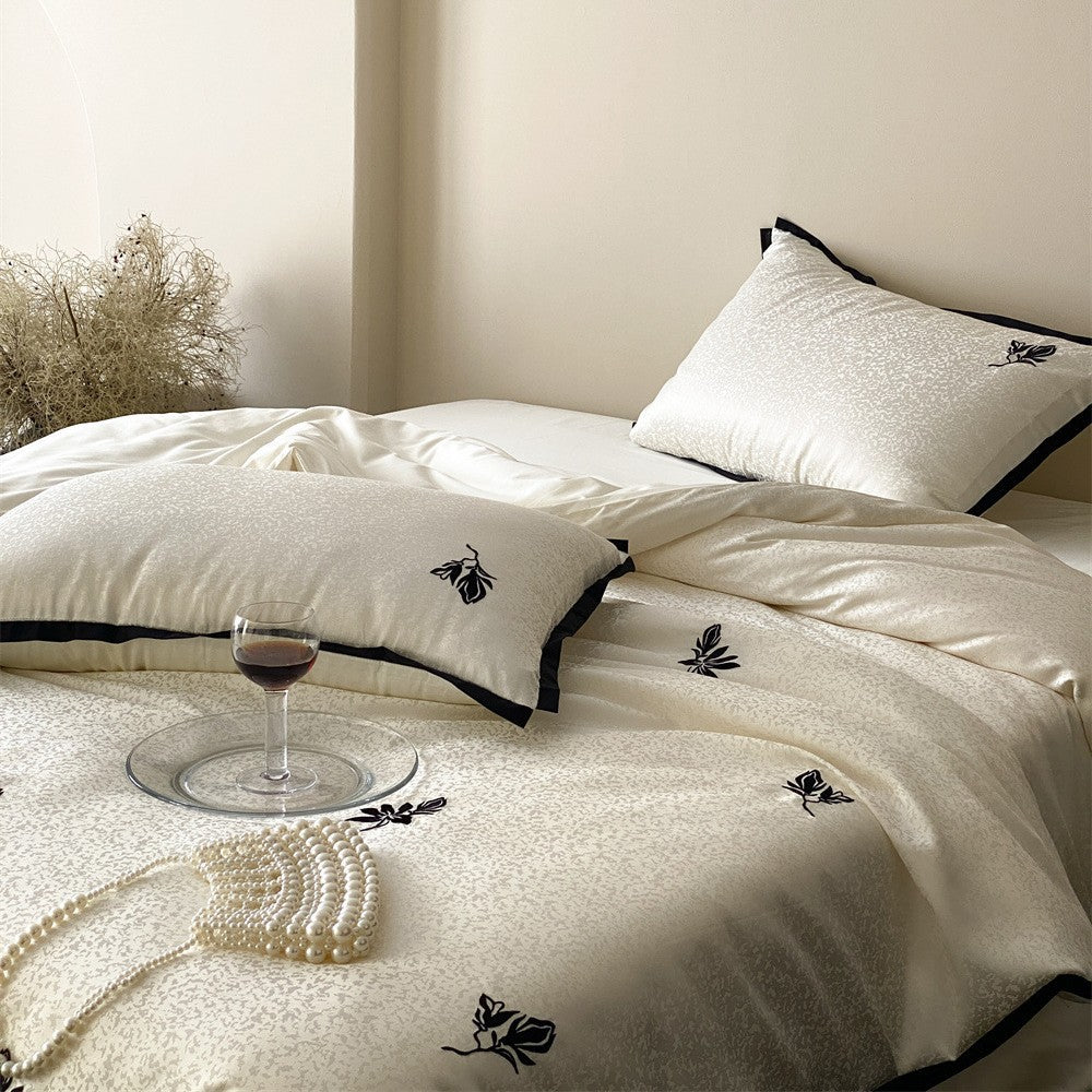 Reversible Jacquard Sateen Duvet Cover Set with Minimalist Botanical Embroidery and Contrast Piped Shams