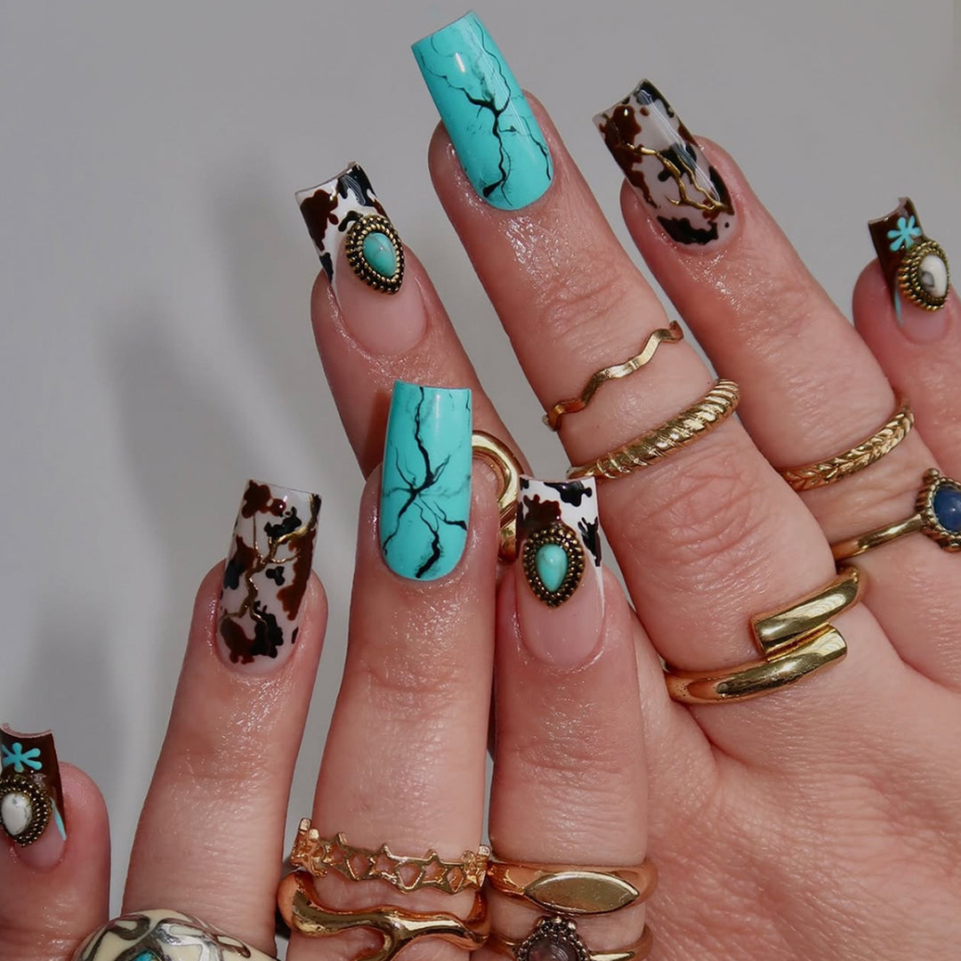 Artful fingernails with unique marble and jewelry design Stornfield