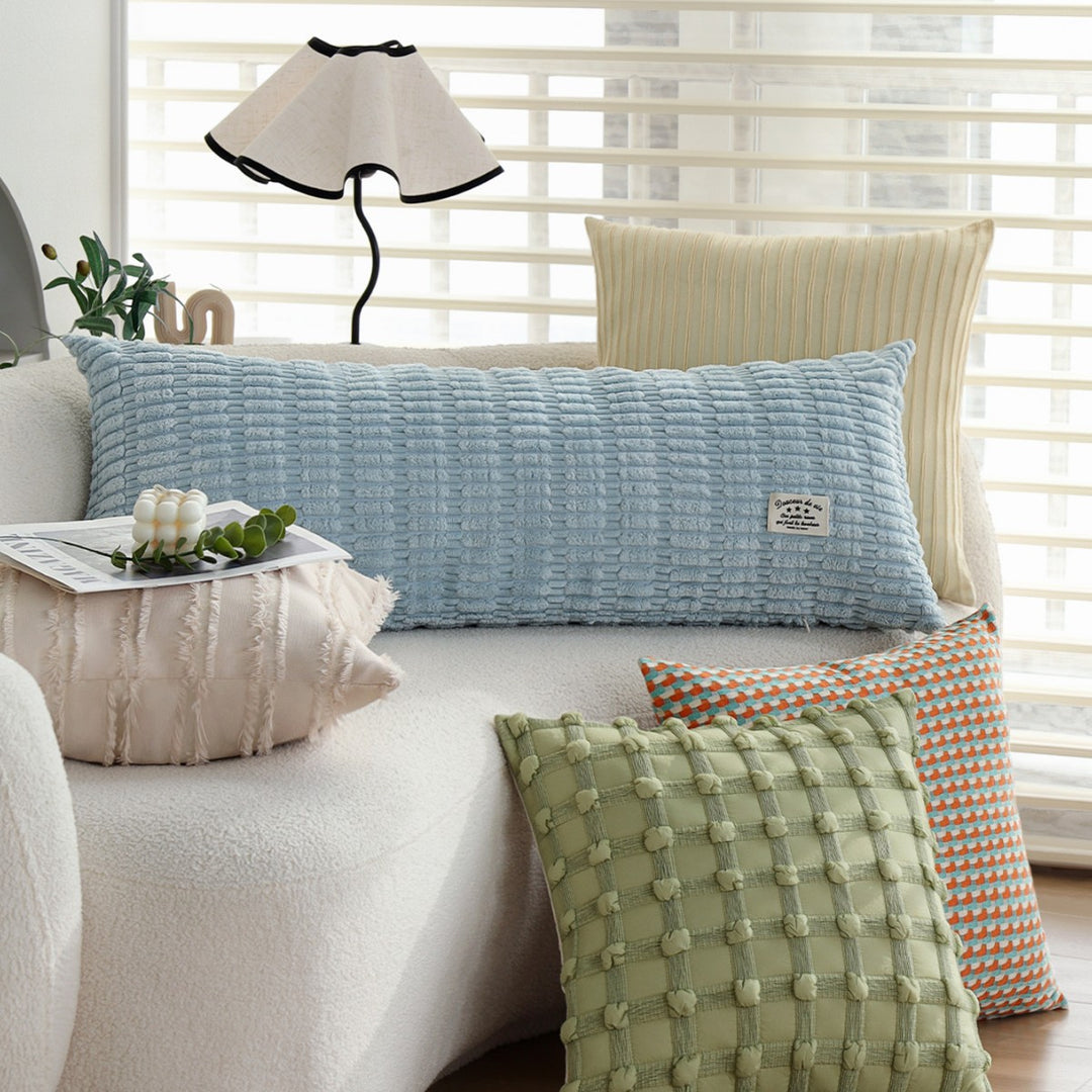 Long decorative pillows with structured surface