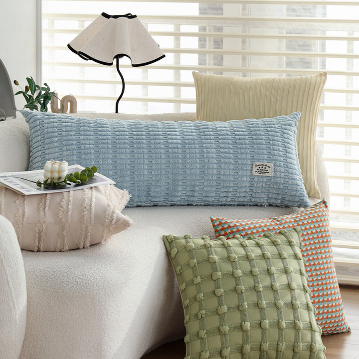 Long decorative pillows with structured surface
