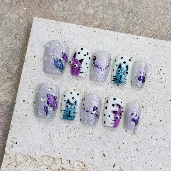 Artistic Press-On Nail Art Set with Unique Whimsical Designs