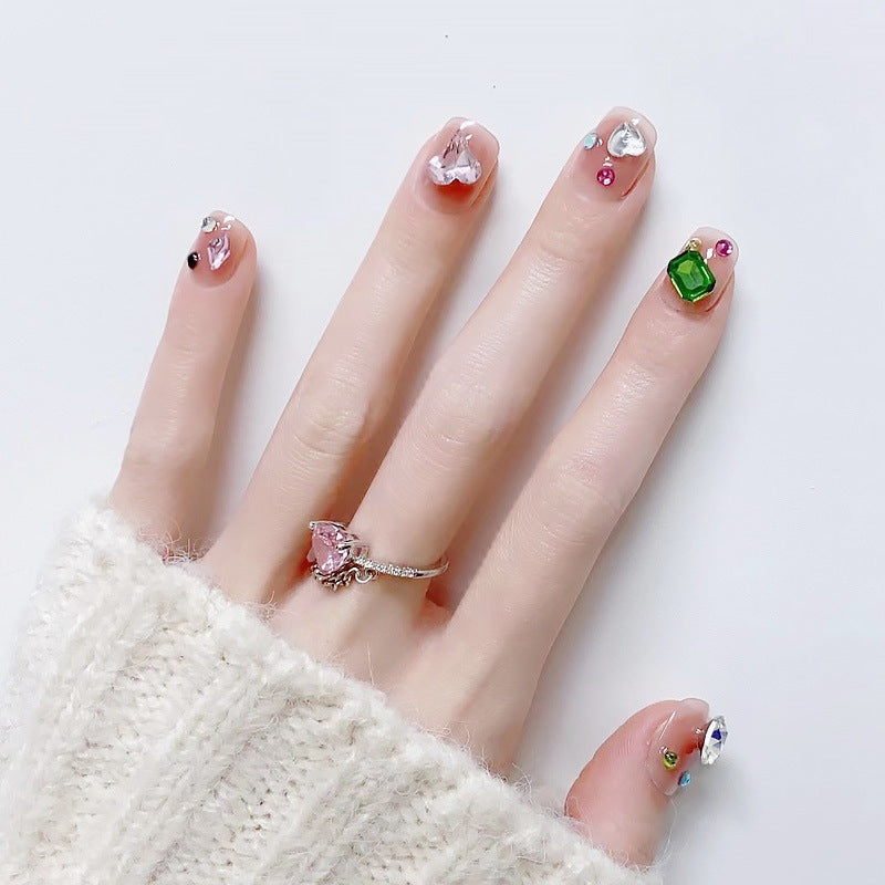 Acrylic nail set with sparkling 3D applications and beautiful heart designs Stornfield