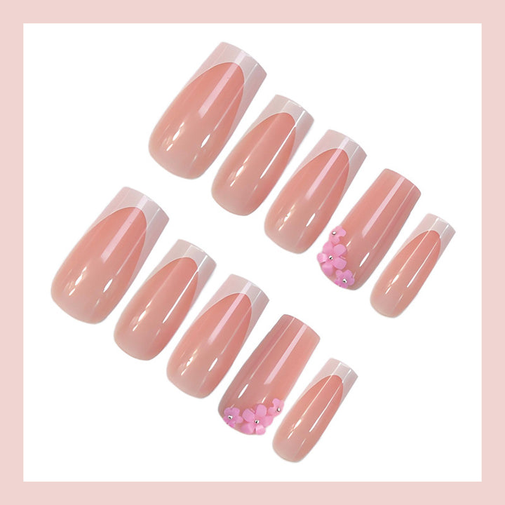 Acrylic nail set with elegant French tips and decorative accents Stornfield