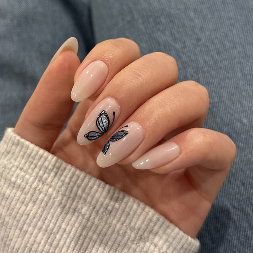 Artful nail extensions with delicate butterfly design Stornfield