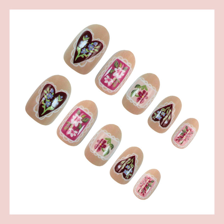 Artificial nail set with floral designs and romantic details Stornfield