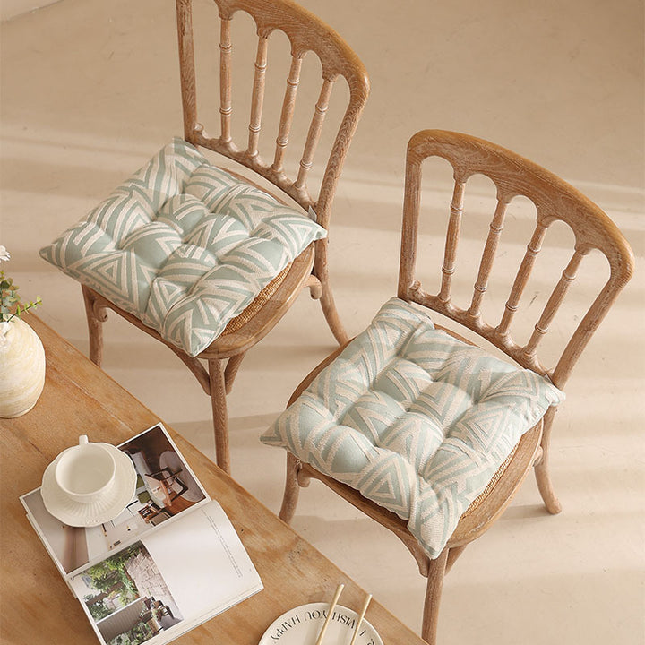 Padded quilted seat cushion with colorful button applications and non-slip underside Stornfield