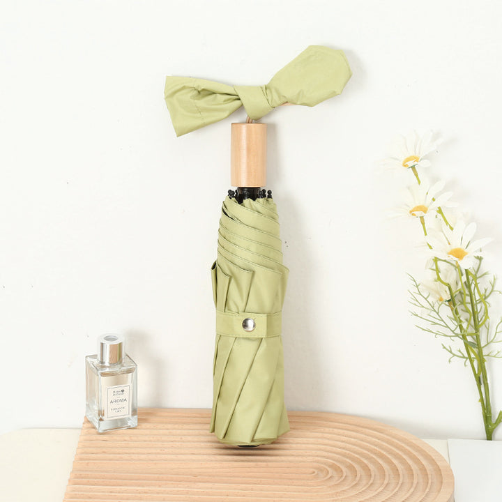 Ladies compact folding umbrella with elegant design and ergonomic wooden handle Stornfield