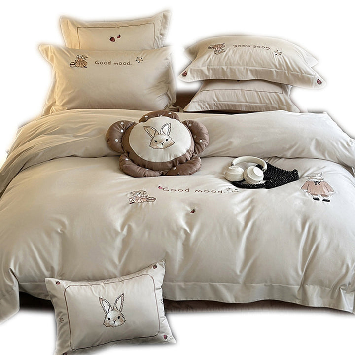 Fine cotton satin bedding set with elaborate bunny embroidery and piped edge
