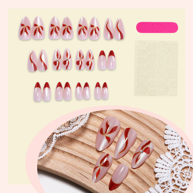 Acrylic nail set with elegant bow and glitter accents Stornfield