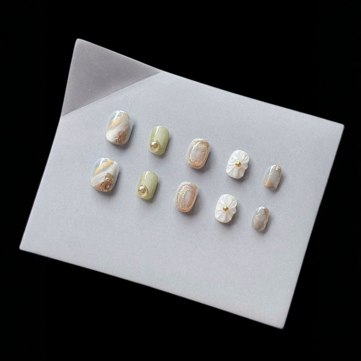 Premium Press-On Nail Art Set with Floral and Metallic Accents