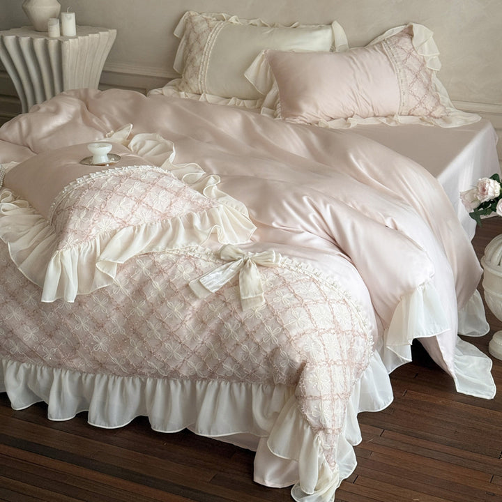 Romantic satin bedding set with ruffle, embroidered lace insert and bow appliqué