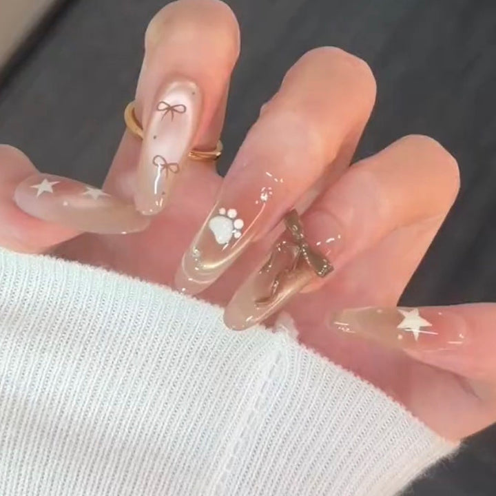 Artificial nail set with festive gift design and elegant glitter accents Stornfield