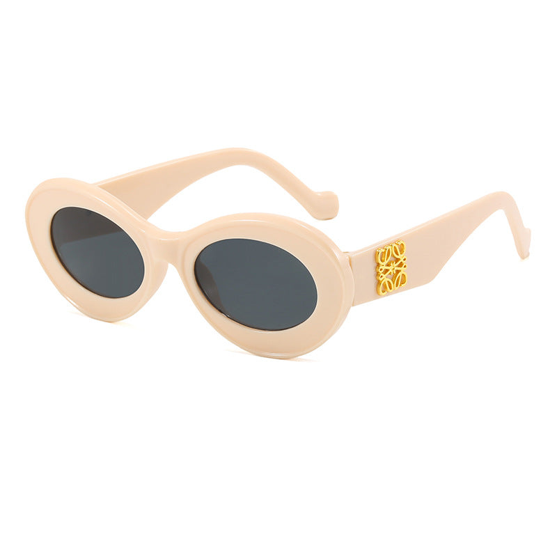 Women's fashionable sunglasses with oval frame and golden applications Stornfield