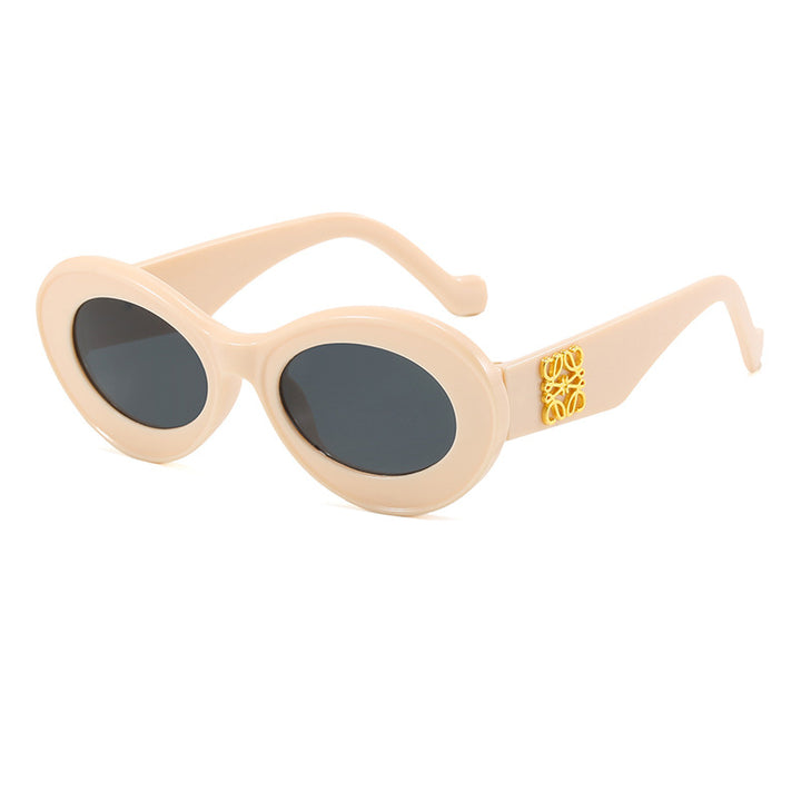 Women's fashionable sunglasses with oval frame and golden applications Stornfield
