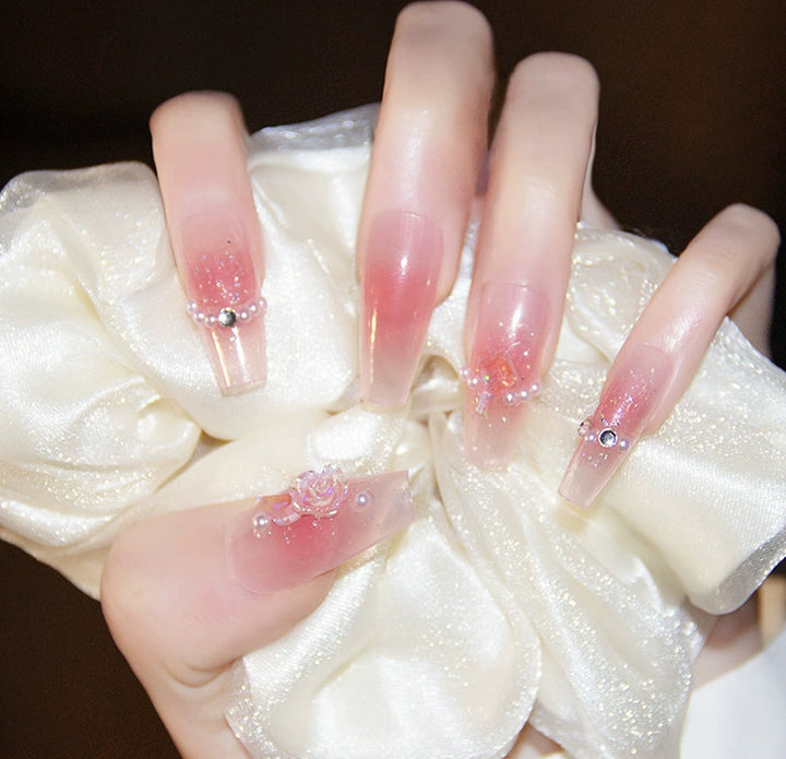 Elegant nail design with pearl embellishment Stornfield
