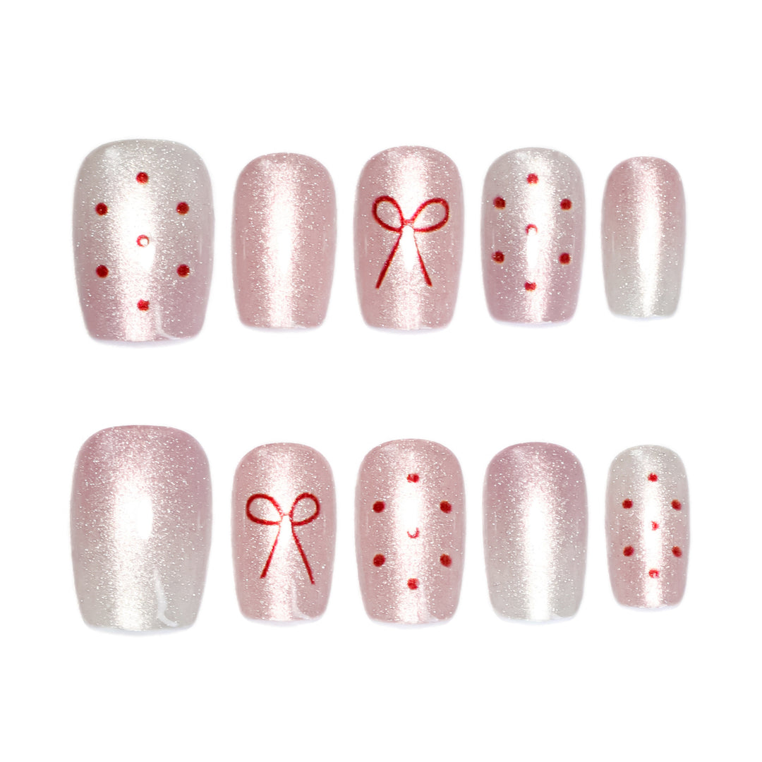 Artificial nail art with cute bow design Stornfield
