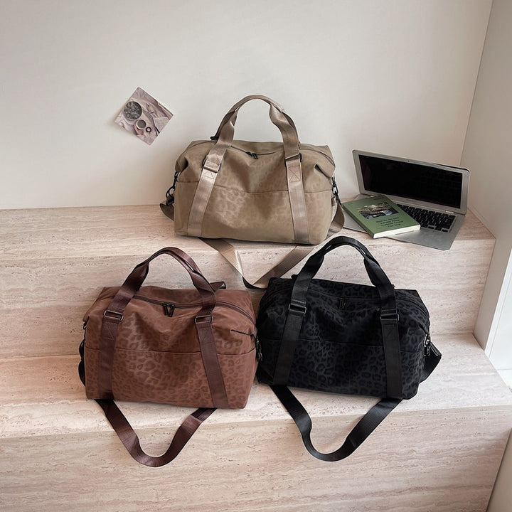 Sporty duffel bag with animal pattern and practical carrying options Stornfield