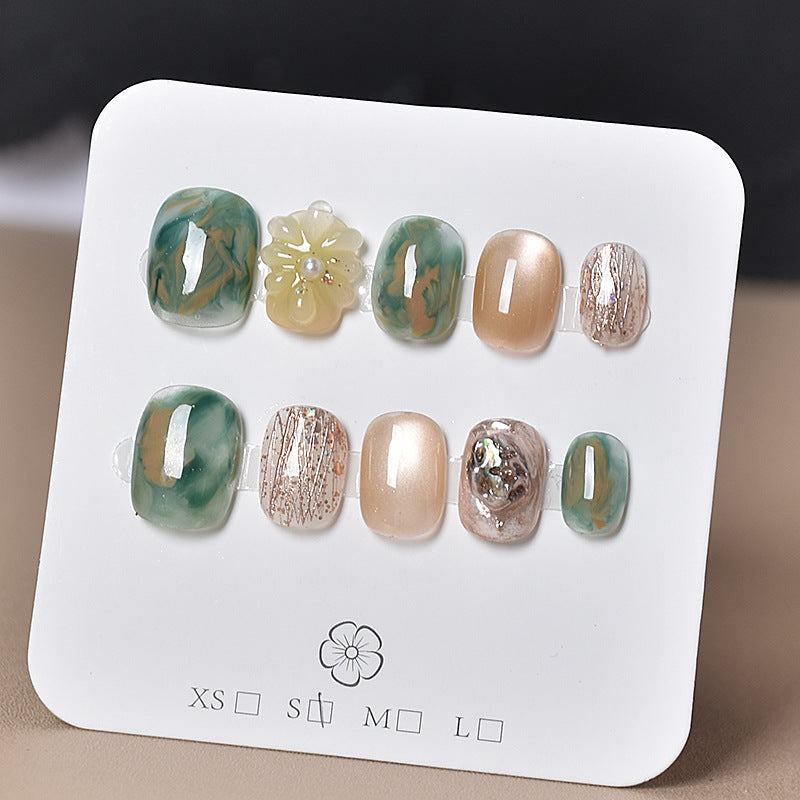 Elegant Nail Art Extensions with Pearl Accents Stornfield