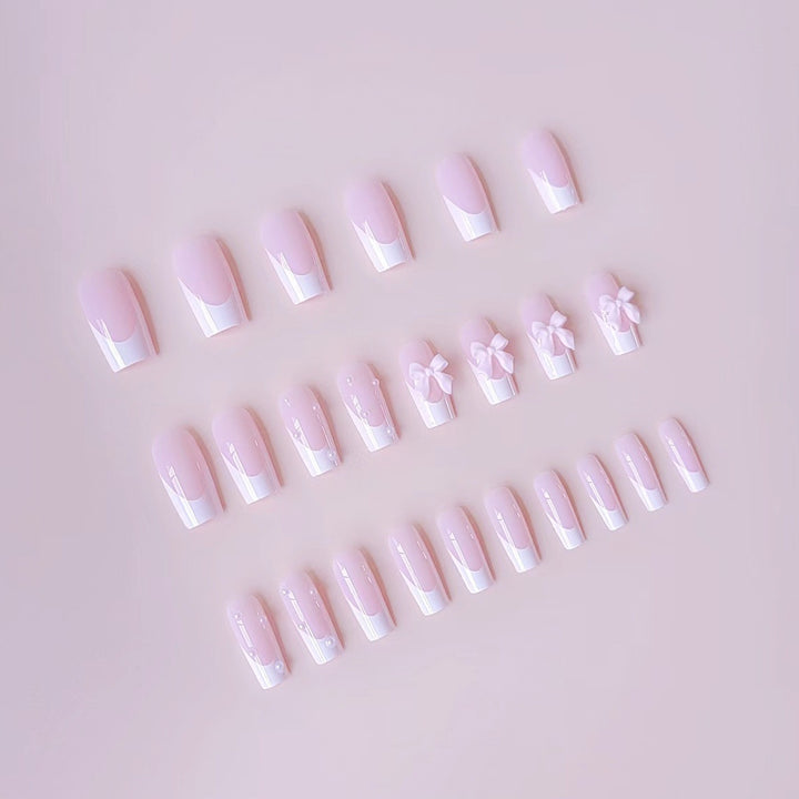 Artificial nail set with elegant bow and pearl decorations Stornfield
