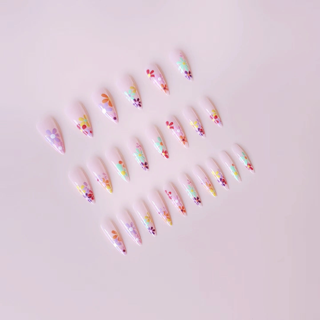 Acrylic nail set with vibrant floral designs and sharp accents Stornfield