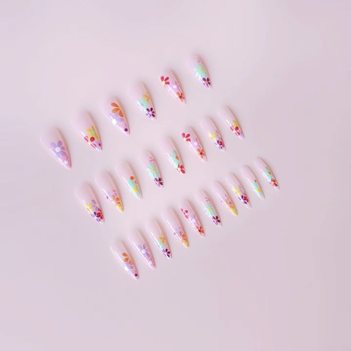 Acrylic nail set with vibrant floral designs and sharp accents Stornfield